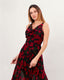 Black long dress with red roses draped neck and crossed back straps