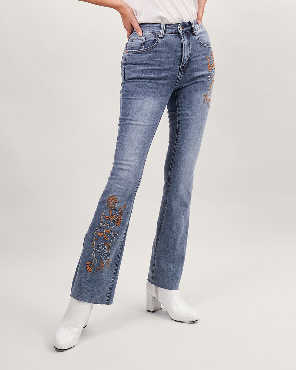 Light blue washed flared jeans with brown floral embroidery