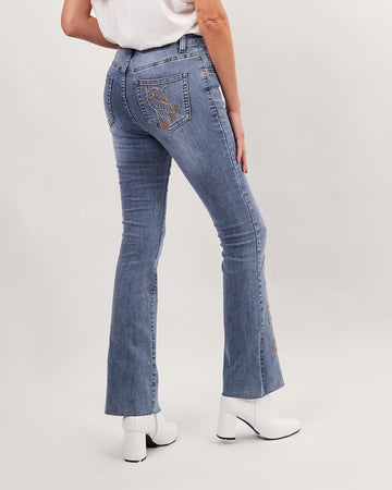 Light blue washed flared jeans with brown floral embroidery